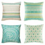 4 cushion with aztec, twirl and wave patterns in teal and white colours.