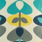 closer look at cushion cover with Teal Yellow and Grey Stem pattern.
