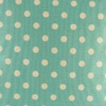 closer look at cushion with Teal and White Polka Dots pattern.