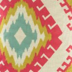 closer look at cushion with Red Yellow and Teal Ikat pattern.