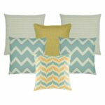A pair of cable knit cushion, one gold cushion, a pair of chevron pattern cushion and one patterned cushion in gold and skyblue colours.