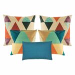 four pieces of multicolored cushion cover and one blue rectangular cushion cover