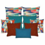Two multi coloured cushion cover with diagonal patterns, a pair of teal coloured cushion cover, a pair of triangle patterned cushion cover, two plain dark orange cushion cover and one blue rectangular cushion cover