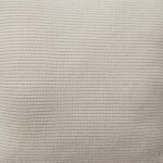Close up photo of brown knitted cushion cover