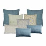 Stone blue and yellow cushions in varying sizes and textures