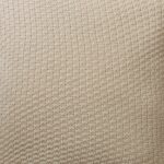 Close up photo of beige cushion cover made of wool knit material
