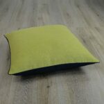 Photo of square, olive and black floor cushion