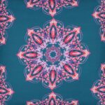 Close up image of carnival inspired, colourful blue and pink outdoor cushion made of water resistant material