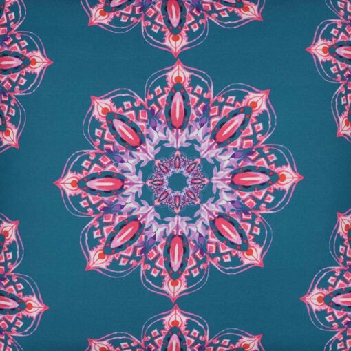 Close up image of carnival inspired, colourful blue and pink outdoor cushion made of water resistant material