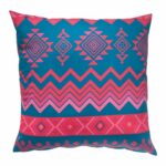Image of pink and blue outdoor cushion with zigzag and diamond patterns