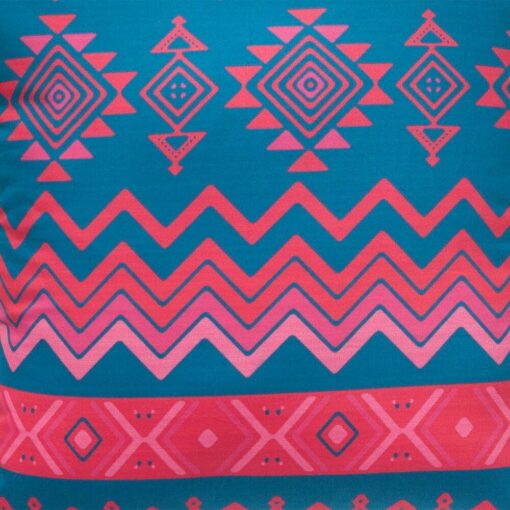 Close up image of geometric outdoor cushion cover with diamonds and zigzag pattern