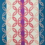 Close up image of colourful outdoor cushion cover with stripes and flower design