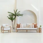 The claybourne set of 7 outdoor sofa cushions sitting on a white sofa.