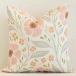 A gorgeous outdoor pink and green square cushion. It has an eye-catching floral design.