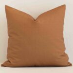 Gorgeous large outdoor cushion cover that has a tan hue. It has a graceful geometric design.