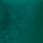 Close up image of emerald green velvet cushion cover