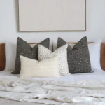 A white bedroom looks classy with the 4 Essa designer bed cushions perfectly placed on a bed.