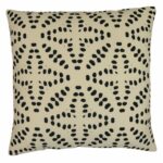 Square outdoor cushion with black polka dots on off white fabric