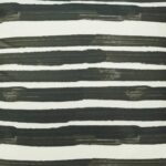 Close up image of black and white outdoor cushion cover with stripes design