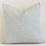 Front view of square cushion. Crafted from a special outdoor material in a blue stripe colour.