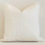Vibrant sand stripe cushion cover constructed from outdoor fabric and shown in a square size.