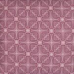 Close up photo of pink water and mould resistant outdoor cushion cover with cross pattern