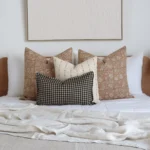 The Laurel bed cushions set consisting of four designer cushions complements the colour of the bed's wooden headboard perfectly.