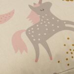 Pastel coloured floor cushion with unicorns and rainbows