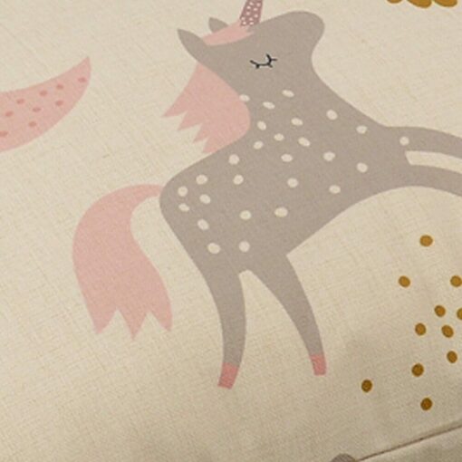 Pastel coloured floor cushion with unicorns and rainbows