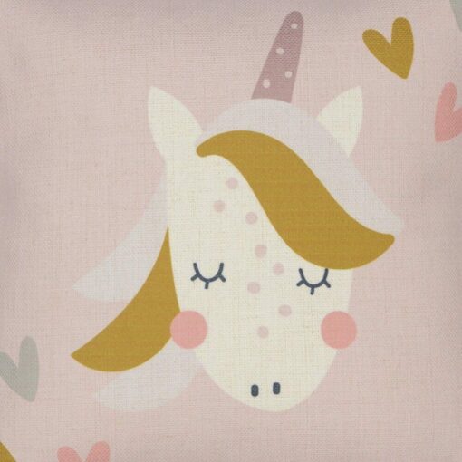 Close up image of pink cushion with colourful unicorn