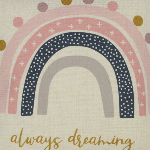Close up image of kids cushion with pink always dreaming rainbow