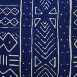 Close up image of African tribal cushion cover in navy blue and white colours