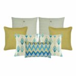 Two cushion covers in cable knit design, two gold cushion covers, two plant pattern cushion covers and one chevron pattern in rectangular shape.
