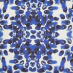Close up image of blue and white square outdoor cushion cover in Mykonos style