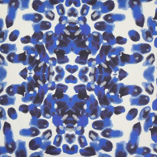 Close up image of blue and white square outdoor cushion cover in Mykonos style