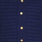Close up of navy blue knit cushion with buttons