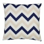 A bold geometric beige and navy print on a water resistant outdoor cushion cover.