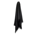 A hook supports a black linen throw.