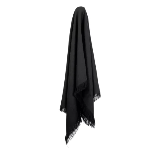 A hook supports a black linen throw.