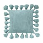 Image of teal knitted cushion cover with tassels