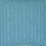 Enlarged photo of knitted cushion fabric in bright teal colour