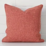 A graceful square auburn cushion made from a durable linen fabric