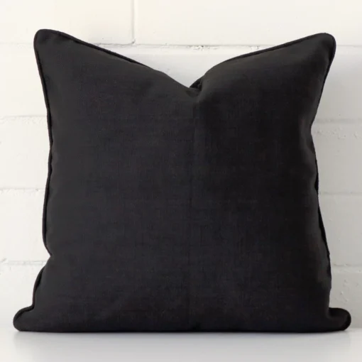 Vibrant black cushion cover constructed from linen fabric and shown in a square size.