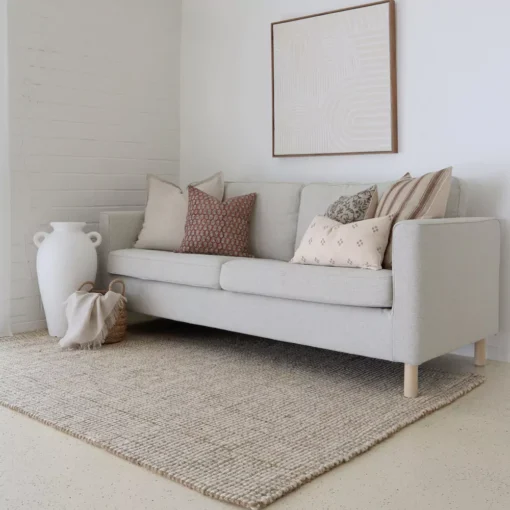 A light grey sofa's elegance is elevated by the Amaro sofa cushions set.