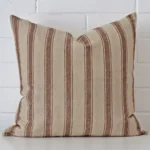 A hero shot of a striped large cushion cover. It is made from a deluxe designer fabric.