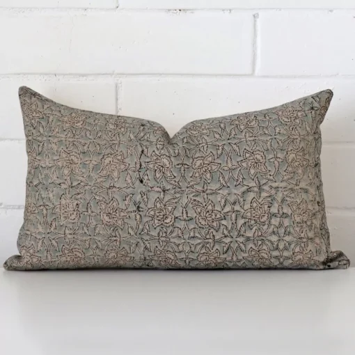 Vibrant floral cushion cover constructed from designer fabric and shown in a rectangle size.