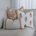 3 couch cushions from the Luka set are arranged in the corner of an elegant sofa.