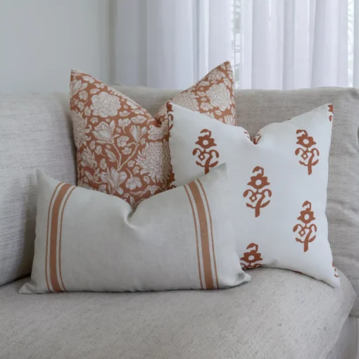 3 couch cushions from the Luka set are arranged in the corner of an elegant sofa.