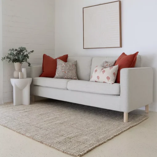 The set of 5 Avery sofa cushions looks perfectly matched with the light grey sofa.