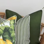 A zoom in view of this set of 3 olive outdoor cushion covers.